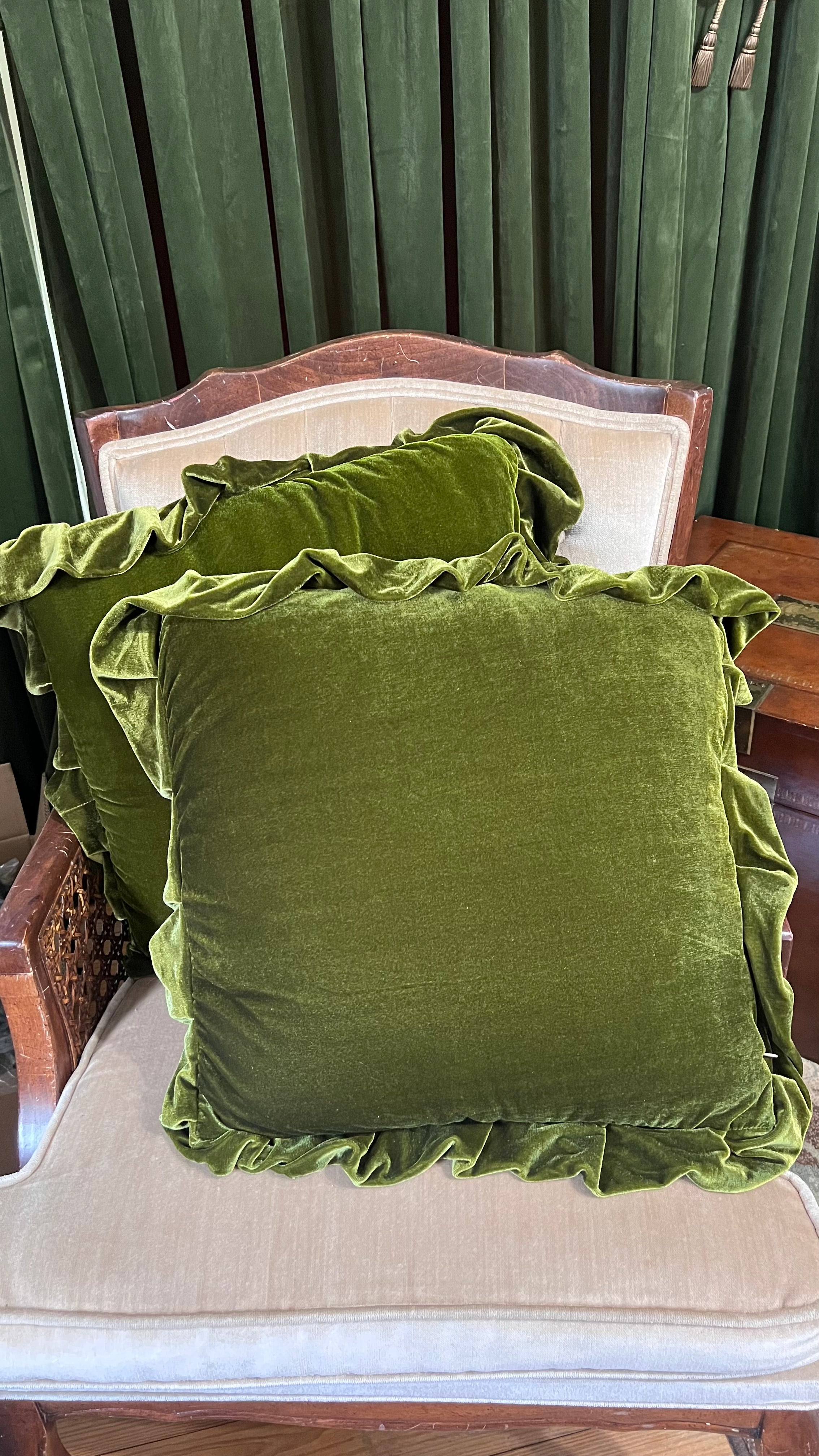 Pair of green velvet decorative pillows with ruffle