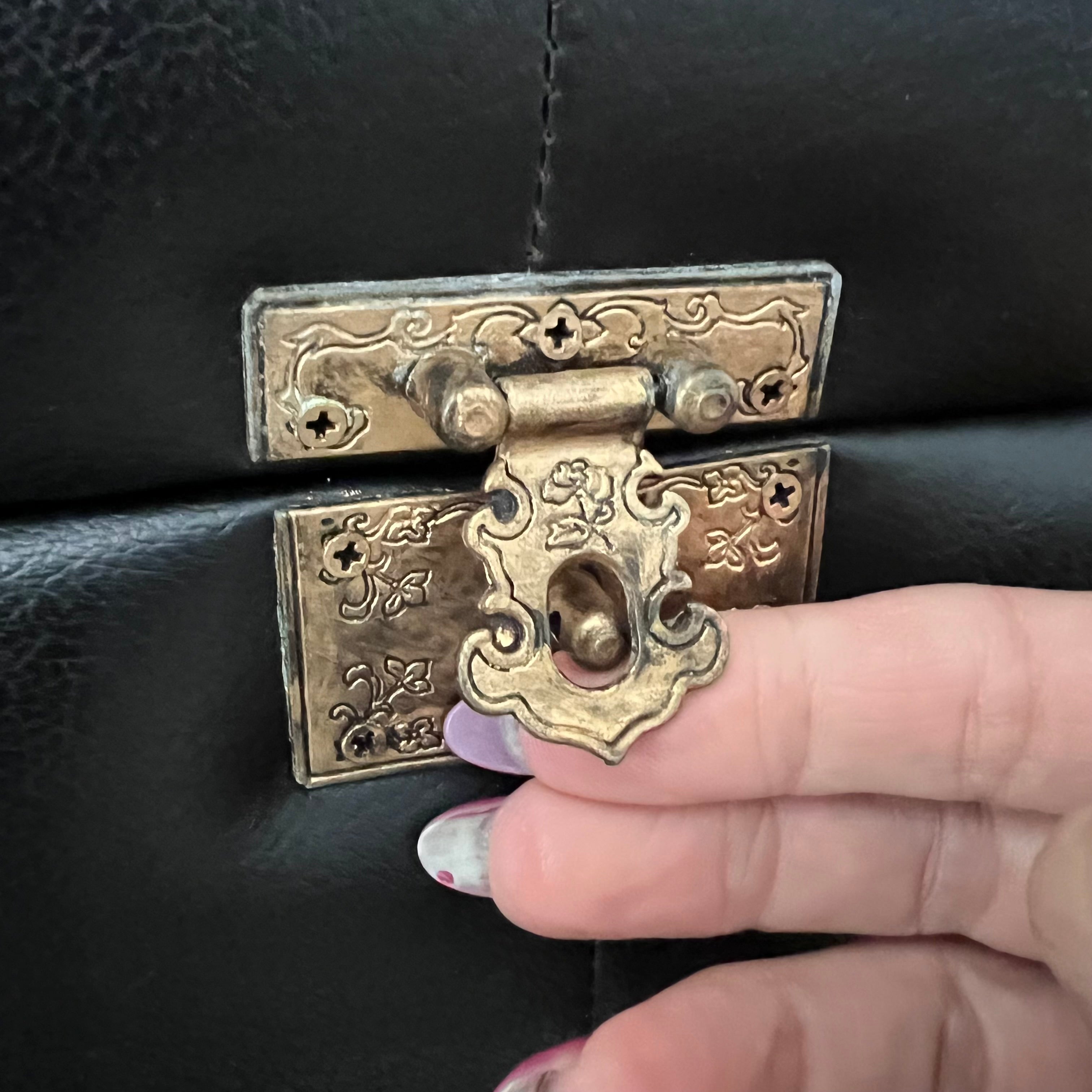 Vintage faux black leather tufted storage trunk